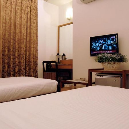 The Ambience Hotel Пюн Стая снимка