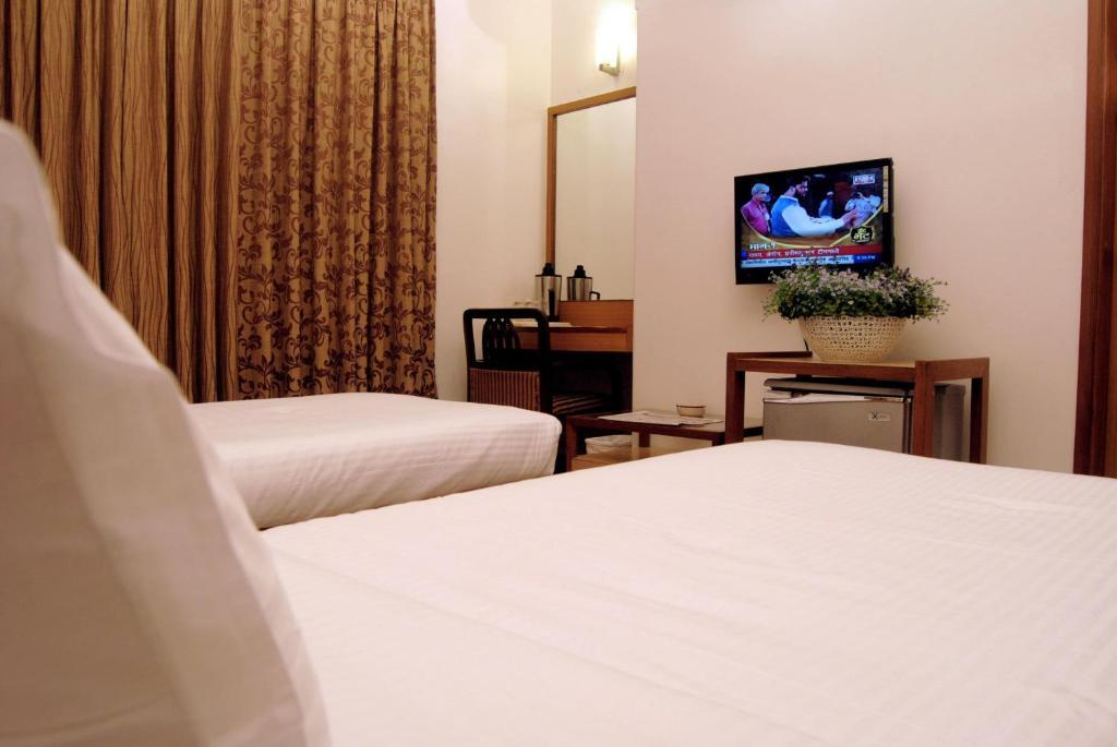 The Ambience Hotel Пюн Стая снимка