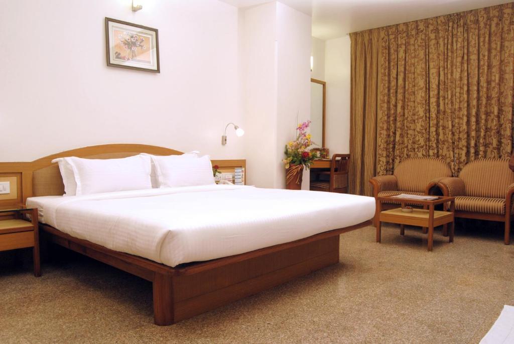 The Ambience Hotel Пюн Стая снимка